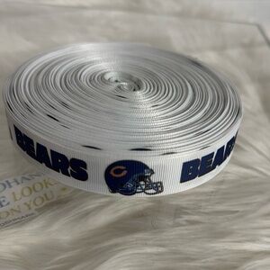 A roll of grosgrain ribbon featuring the Chicago Bears logo and team name.
